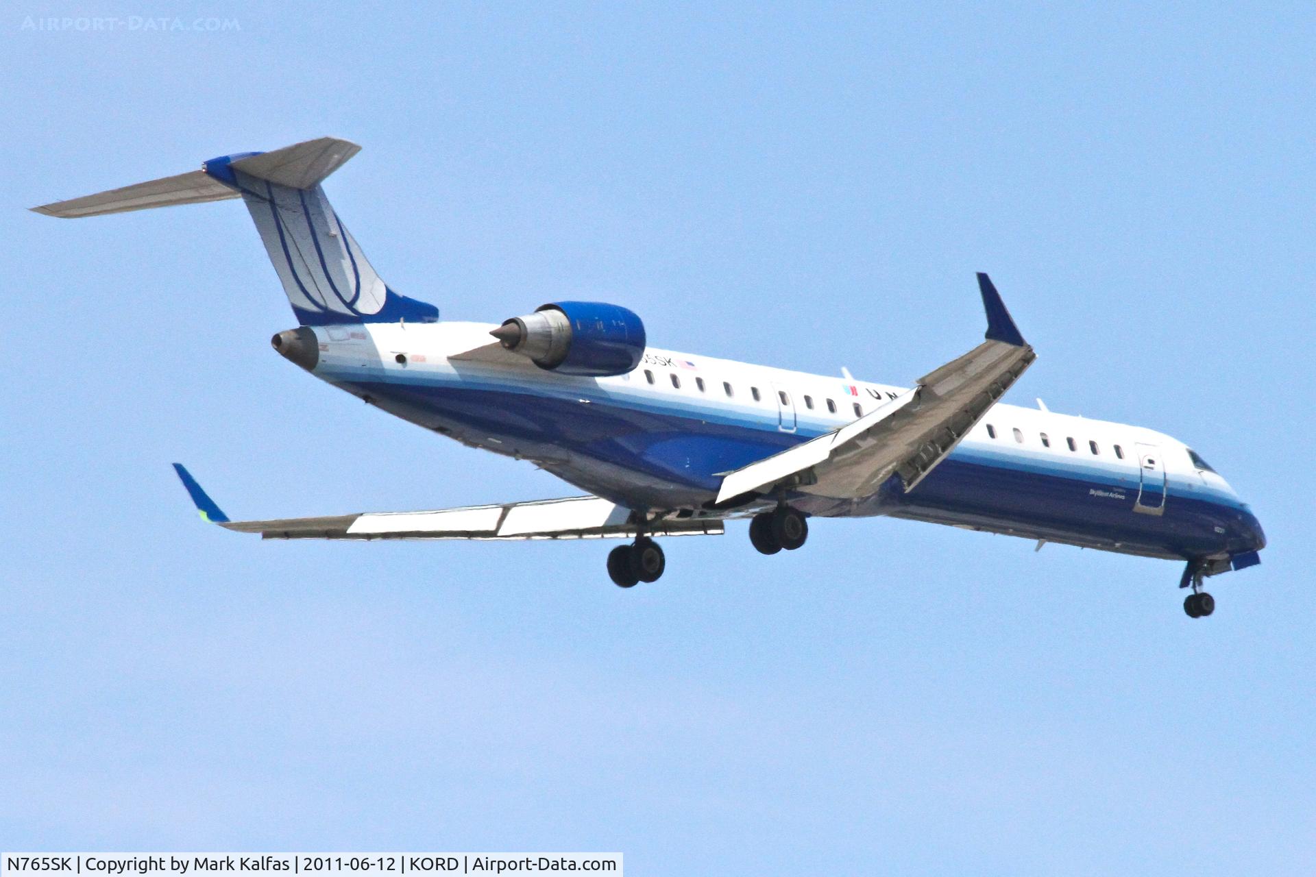 N765SK, 2005 Bombardier CRJ-702 (CL-600-2C10) Regional Jet C/N 10231, SkyWest/United Express Bombardier CL-600-2C10, SKW6487 arriving from CYYC, RWY 10 approach KORD.
