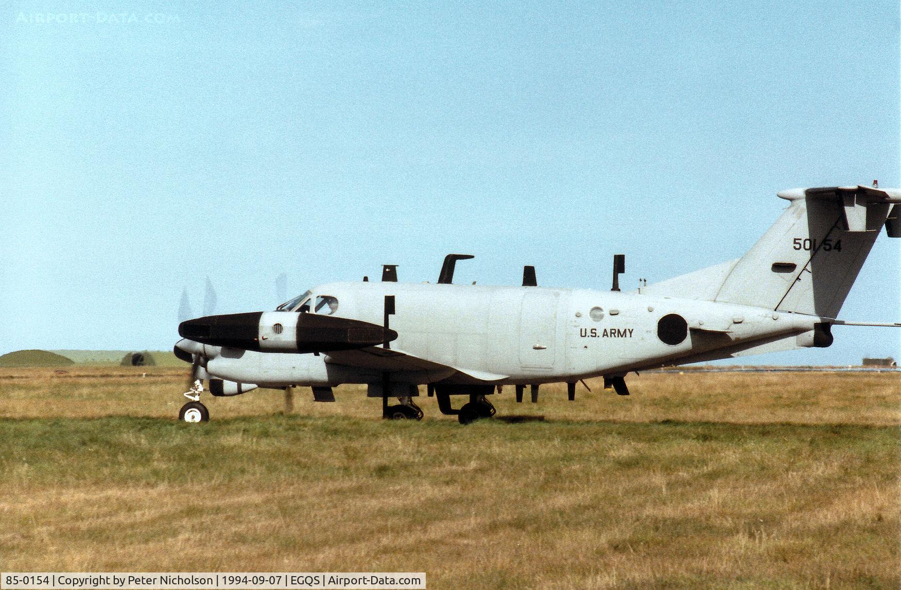 85-0154, 1985 Beech RC-12K Huron C/N FE-008, RC-12K Huron, callsign Argus 2 Alpha, of 1st Military Intelligence Battalion awaiting clearance to join the active runway at RAF Lossiemouth in September 1994.