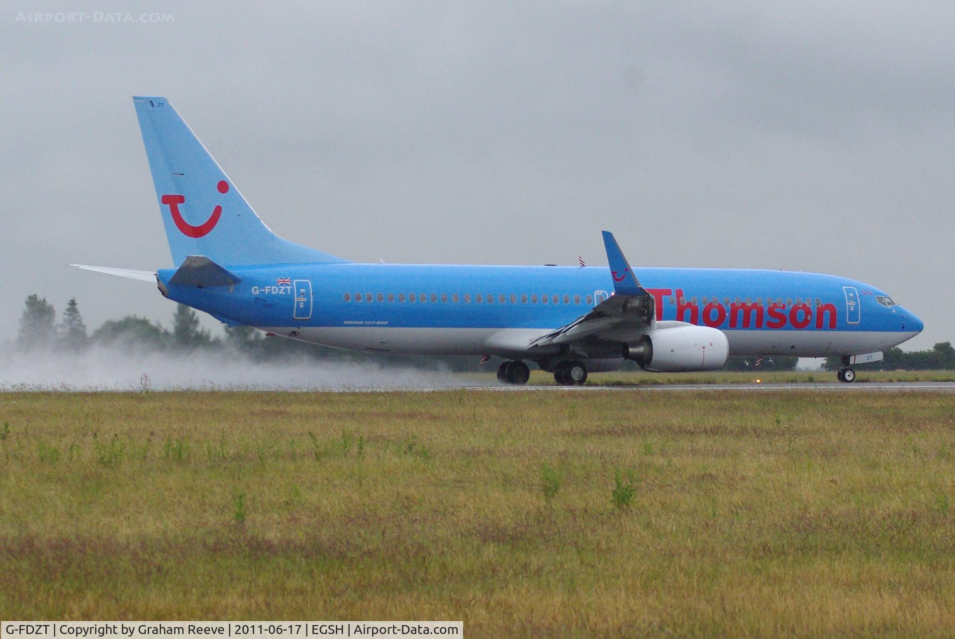 G-FDZT, 2011 Boeing 737-8K5 C/N 37248, Taking off on a wet afternoon.