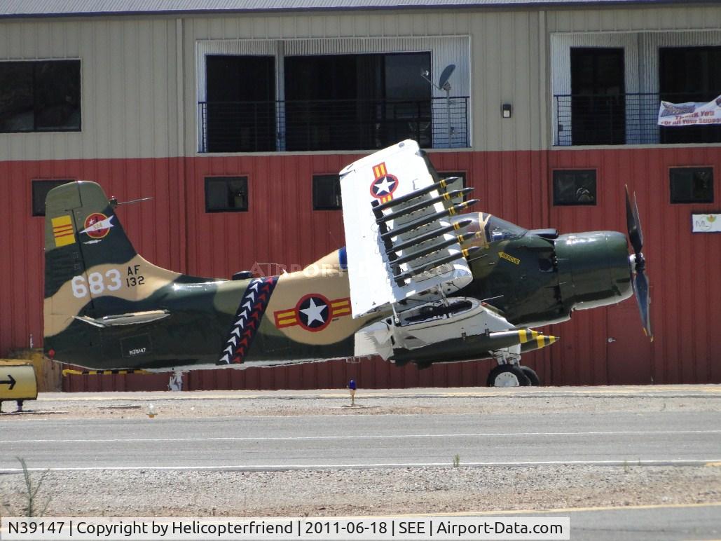 N39147, Douglas AD-5 (A-1E) Skyraider C/N 9540, Parked on the south side of runway 35/17, with wings folded up