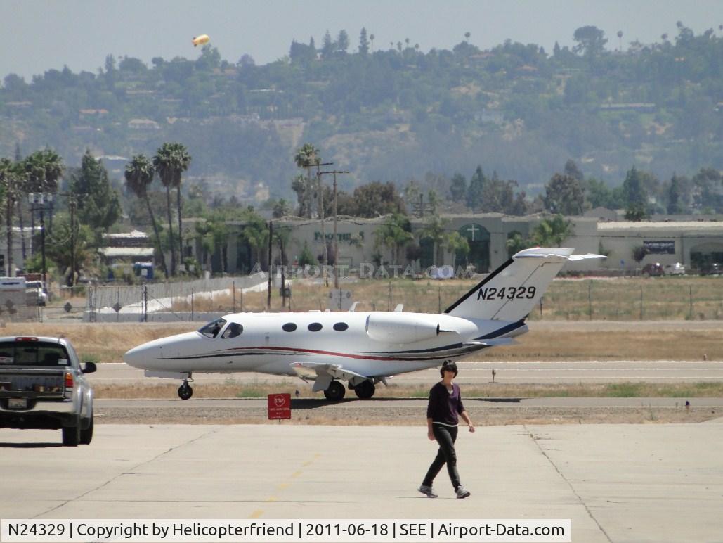 N24329, 2007 Cessna 510 Citation Mustang C/N 510-0020, Taxiing northbound, photographer being observed by an employee