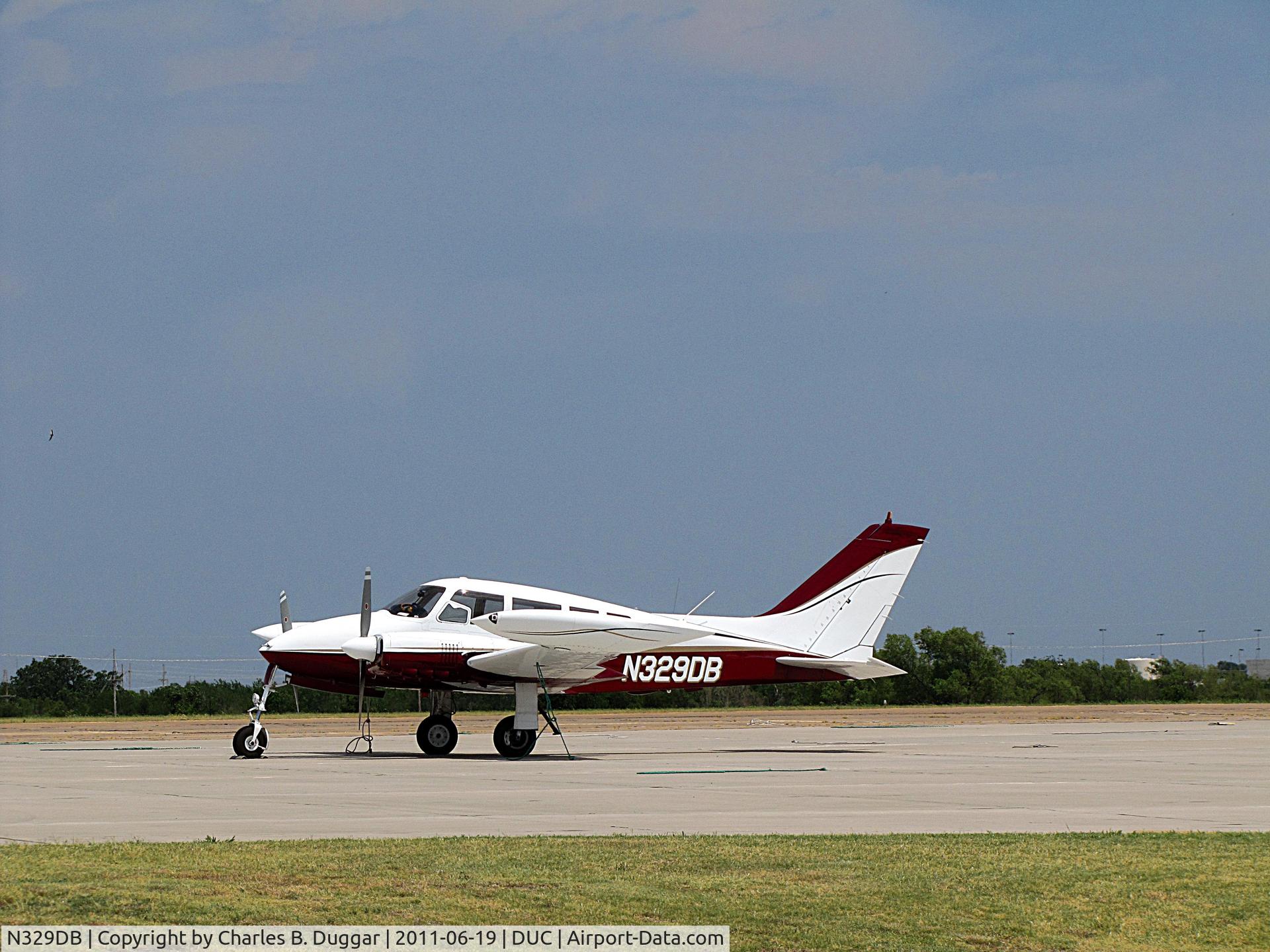 N329DB, 1964 Cessna 320B Skyknight C/N 320B0015, Hot day at Halliburton Field in Duncan, OK.