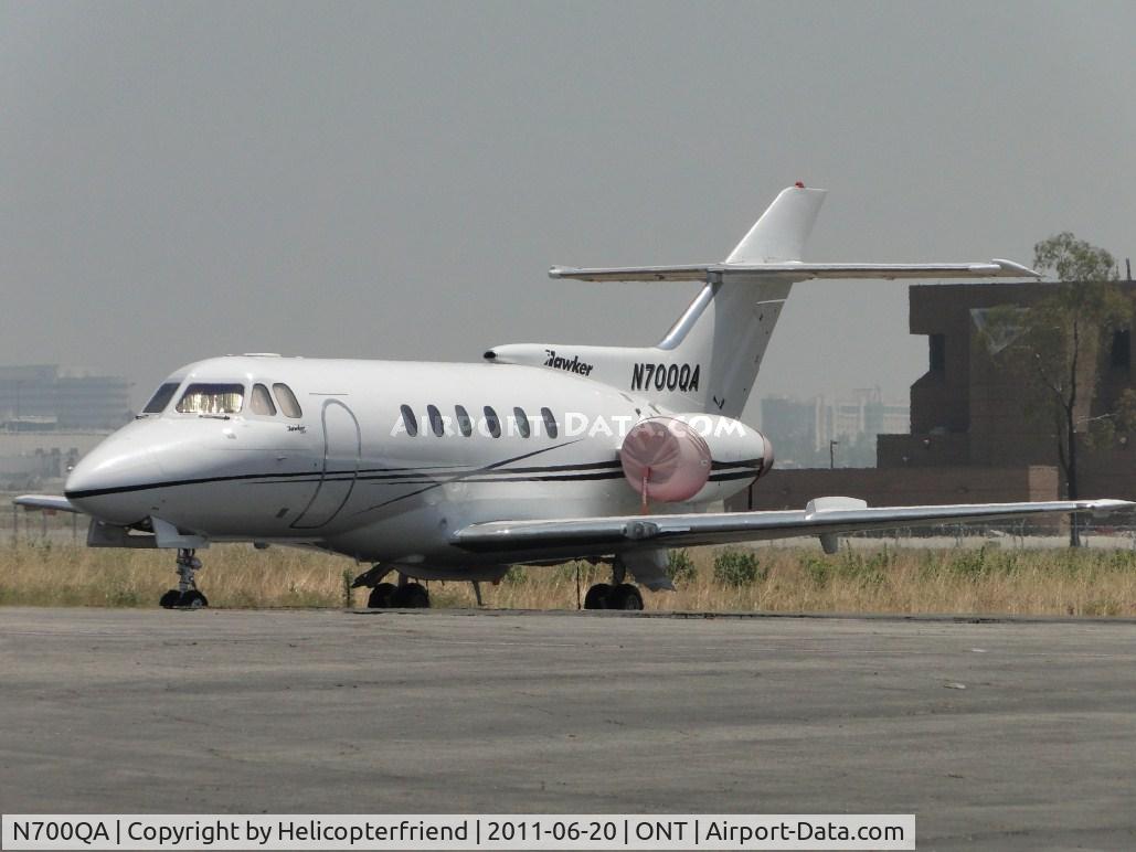 N700QA, 1978 British Aerospace HS.125-700A C/N NA0237, Covered and parked at the grasses edge on the southside