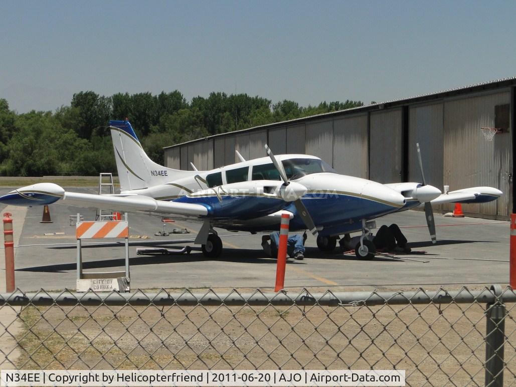 N34EE, 1966 Piper PA-30 Twin Comanche Twin Comanche C/N 30-1138, Parked and two people working on her