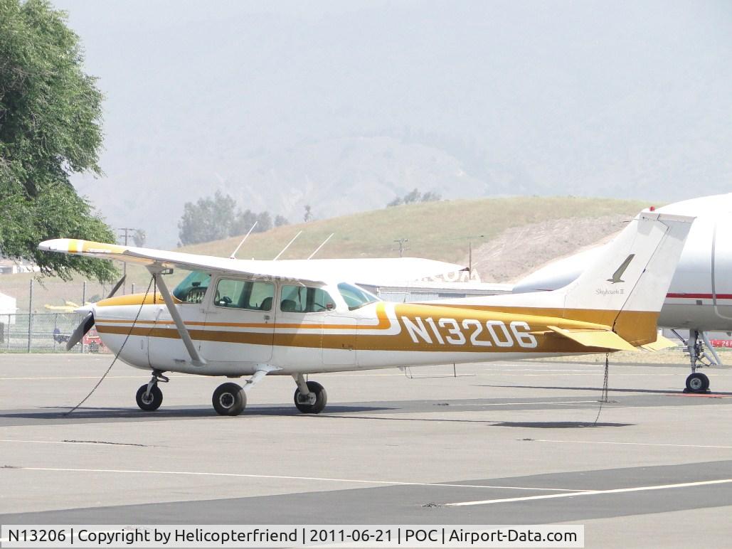N13206, 1973 Cessna 172M C/N 17262573, Tid down and parked in transient parking