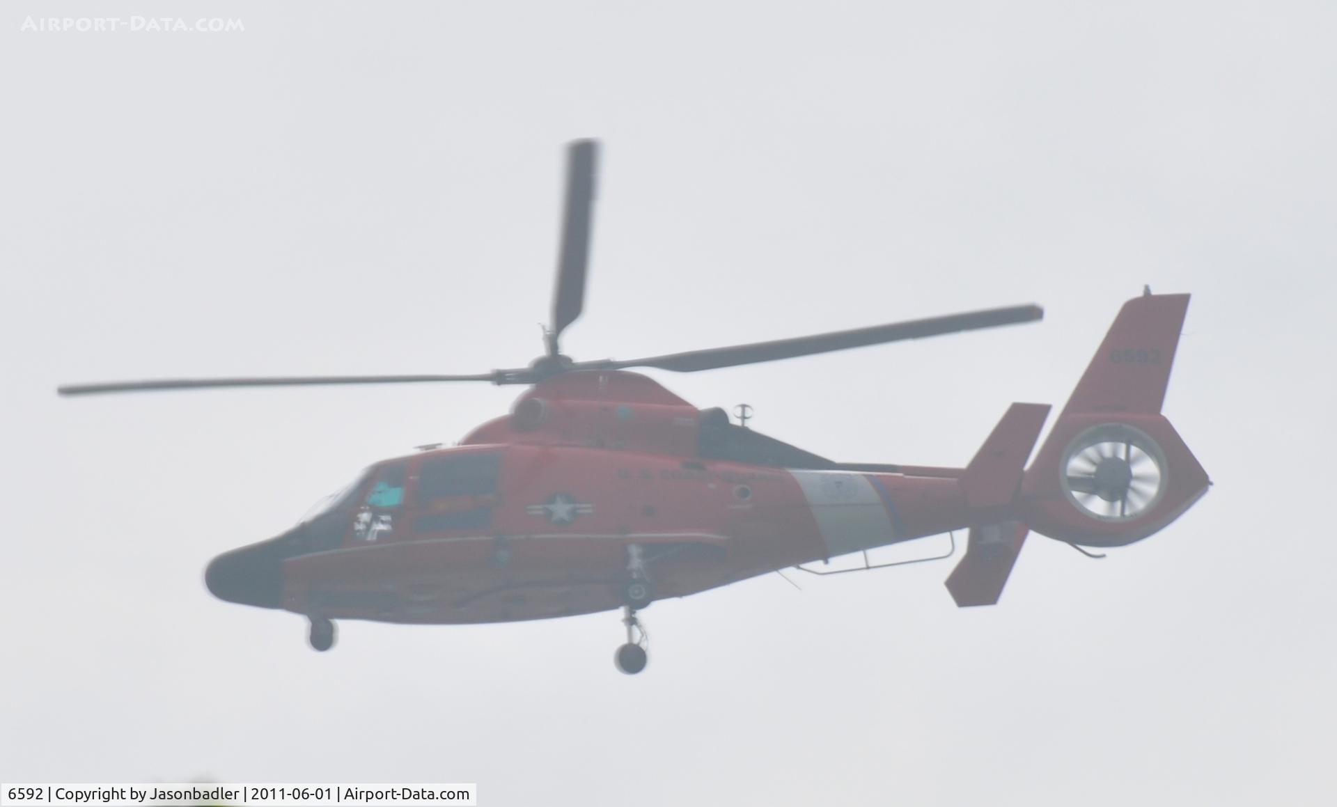 6592, 1985 Aerospatiale MH-65C Dolphin C/N 6293, I took this photo from my house and really couldn't make out the tail number but 6592 looks right. Please correct me if I'm wrong.
