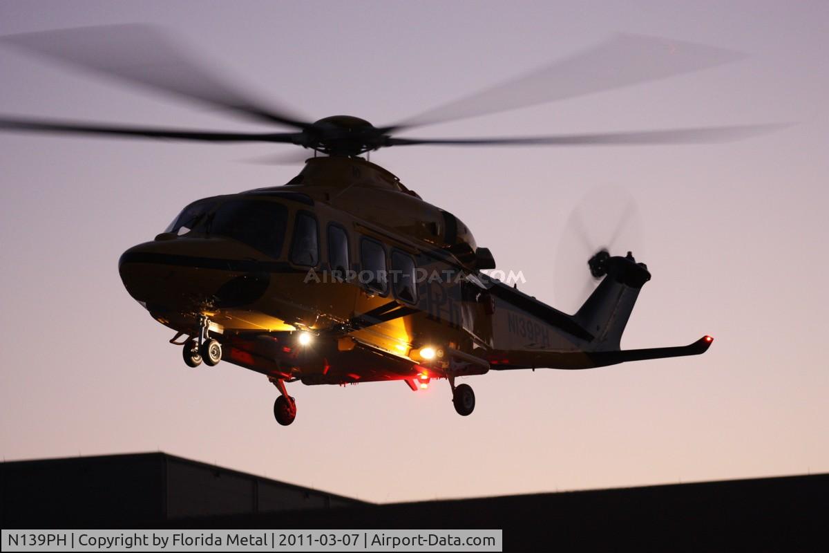 N139PH, 2008 AgustaWestland AW-139 C/N 31121, PHI AW 139 leaving Heliexpo Orlando at dusk