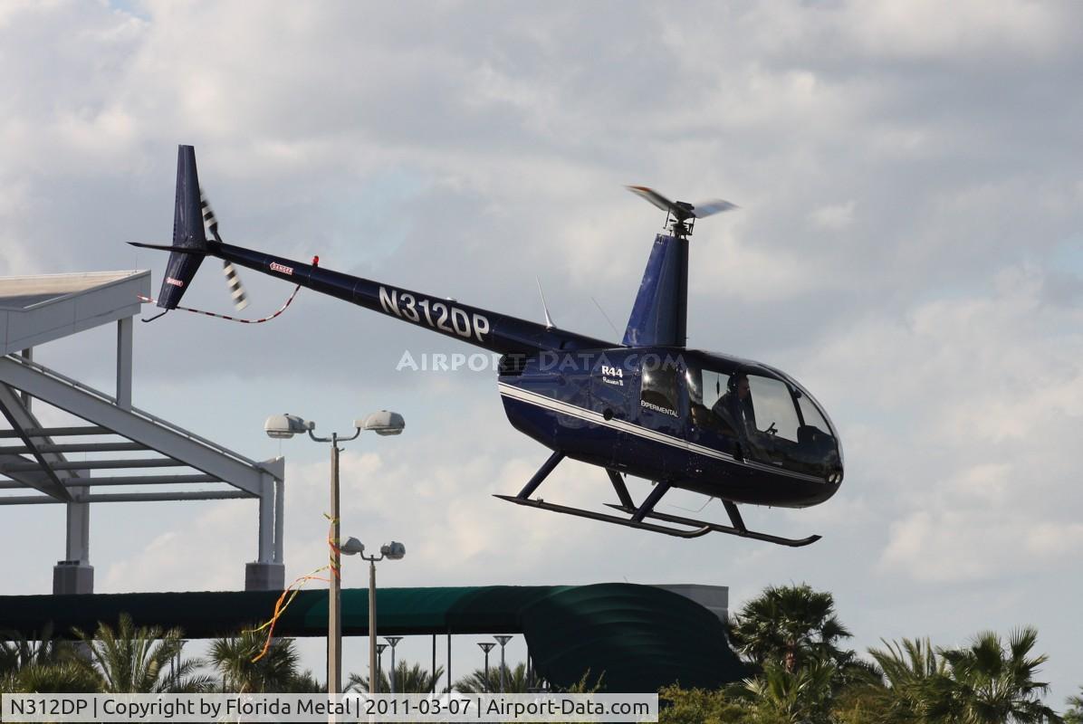 N312DP, 2003 Robinson R44 II C/N 10057, R44 leaving Heliexpo Orlando