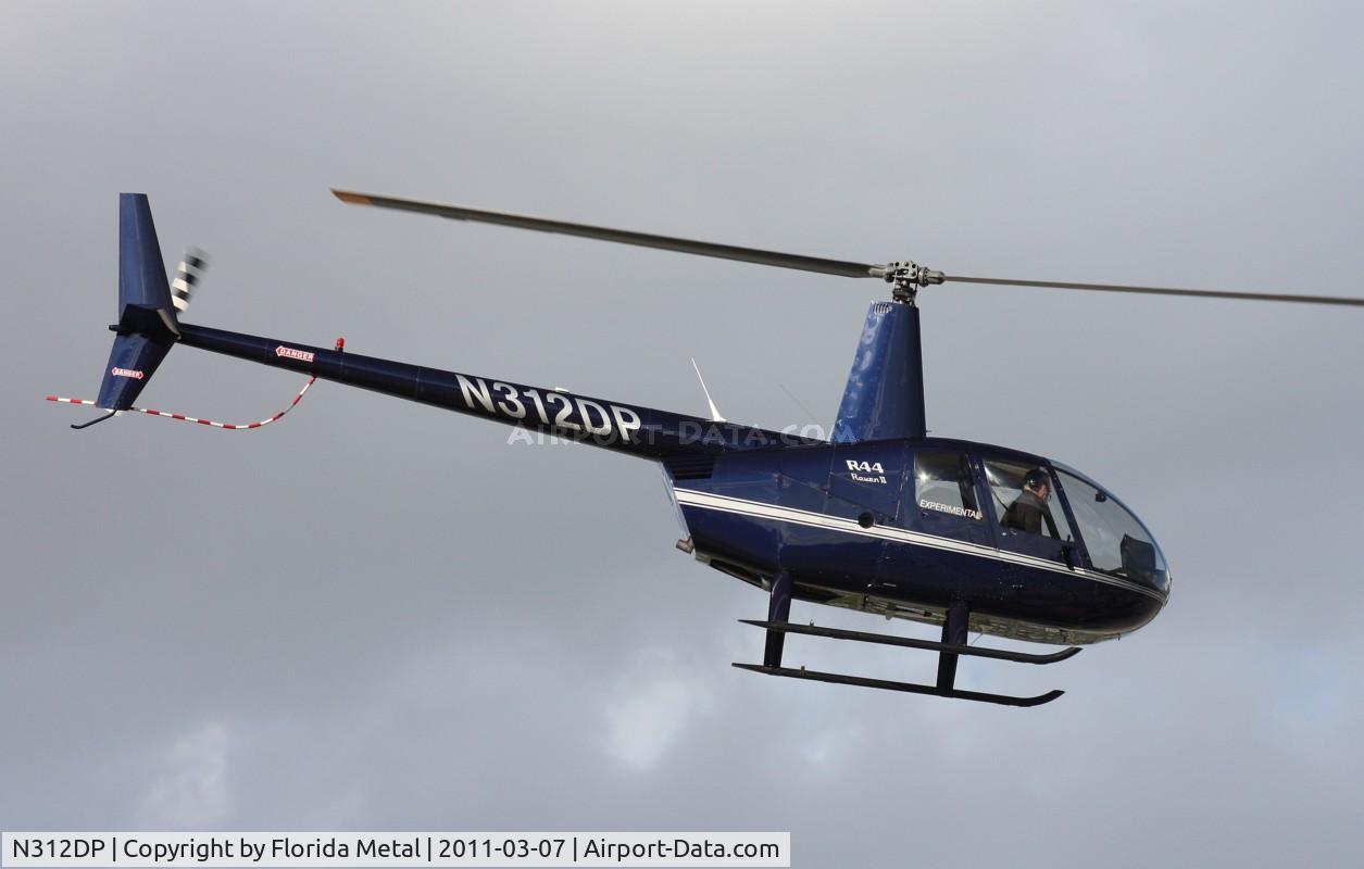N312DP, 2003 Robinson R44 II C/N 10057, R44 leaving Heliexpo Orlando