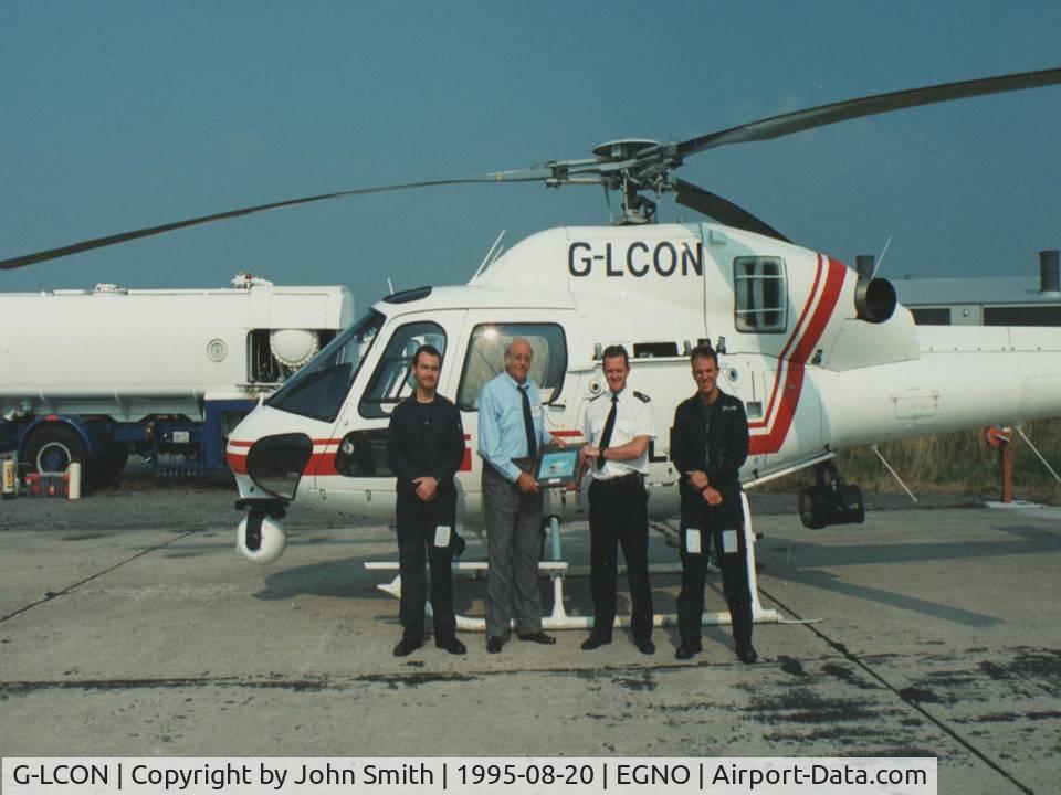 G-LCON, 1994 Eurocopter AS-355N Ecureuil 2 C/N 5572, August 1995: Photograph taken at BaE Warton, Preston, Lancashire, England. This was a presentation ceremony to  former Police Sergeant Jack Smith (Lancashire Constabulary) , the UKs first regular police air patrol officer.