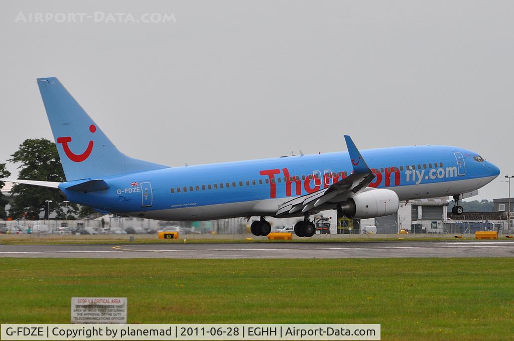 G-FDZE, 2008 Boeing 737-8K5 C/N 35137, Touching-down on 26, taken from the Flying Club