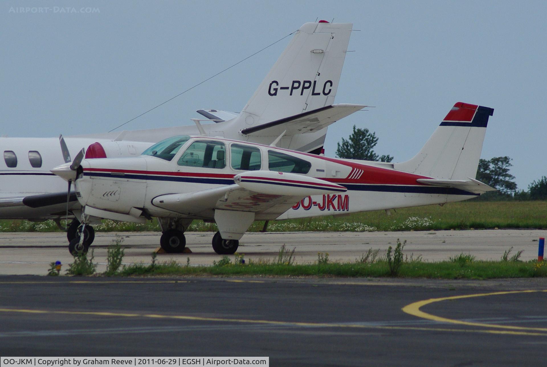 OO-JKM, 1974 Beech F33A Bonanza C/N CE487, Parked at Norwich.