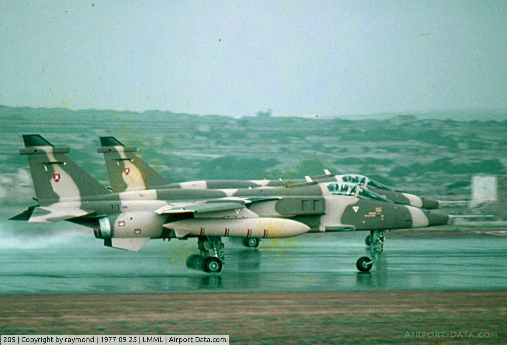 205, 1977 Sepecat Jaguar S C/N 210/S(O)3, Jaguars 205 and 206 of Oman Air Force being delivered through Malta in September 1977. Seen here on departure double take-off.