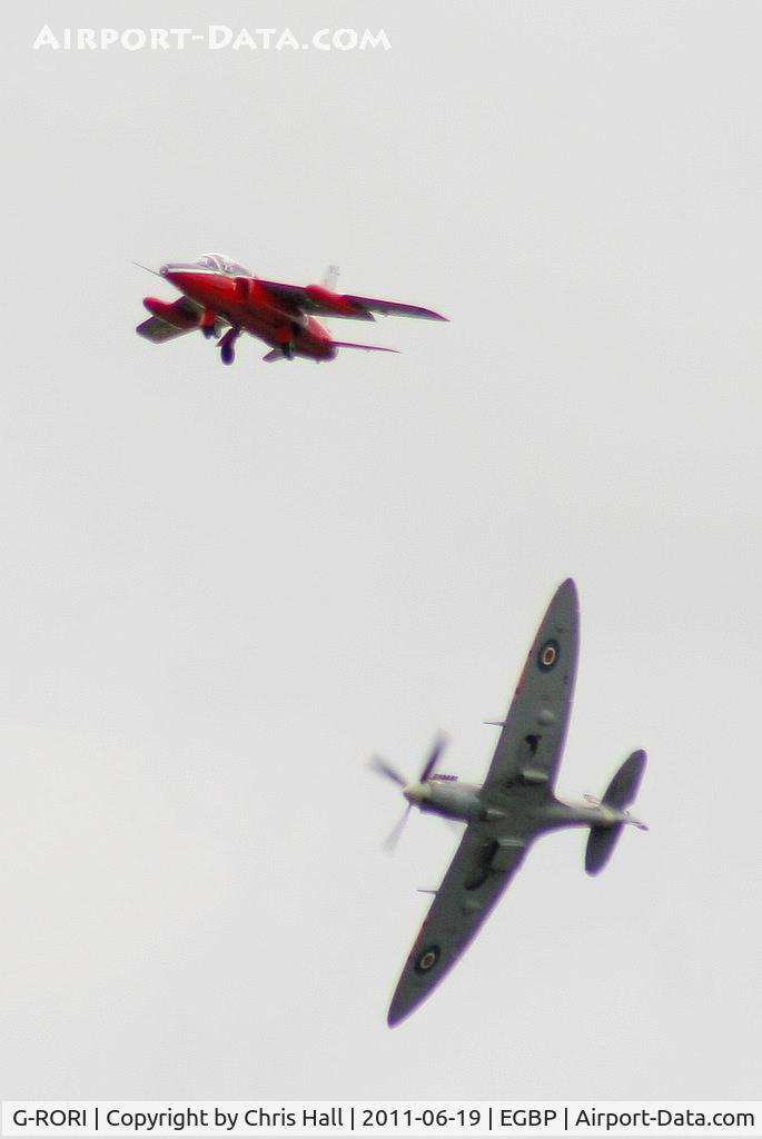 G-RORI, 1963 Hawker Siddeley Gnat T.1 C/N FL549, BBMF Spitfire AB910 making a visual inspection of the undercarriage on G-RORI after the cockpit indicators showed it had not locked down, thankfully it was just a faulty indicator.