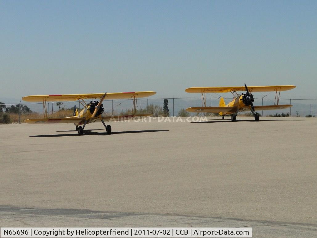 N65696, 1941 Boeing B75N1 C/N 75-2628, both ships preparing to taxi to runway 24 for westerly departure