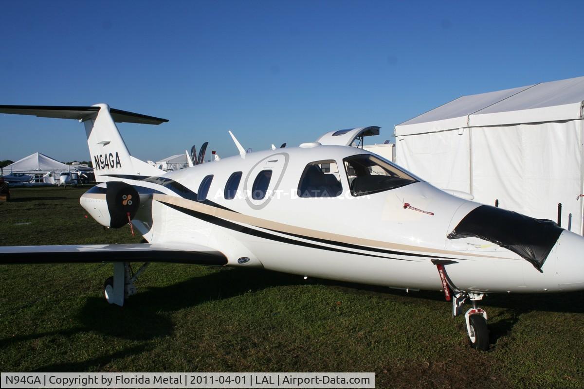 N94GA, 2007 Eclipse Aviation Corp EA500 C/N 000072, Eclipse damaged but flyable after a small plane was flipped on top of it the day before during a strong thunderstorm