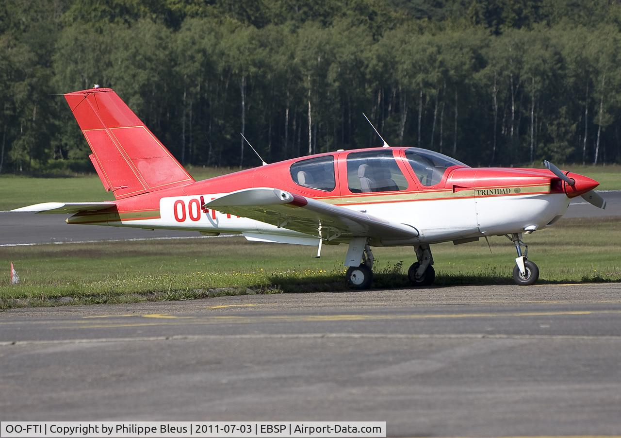 OO-FTI, 1982 Socata TB-20 250 Trinidad C/N 293, Trinidad at parking stand. The Swiss red cross logo at the top of the vertical tail fin has disappeared. Once again, the parking tarmac is NOT horizontal in Spa.
