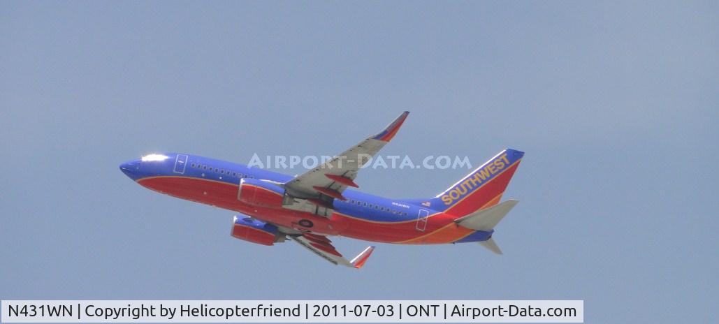 N431WN, 2002 Boeing 737-7H4 C/N 29845, Wheels up, lifting off from runway 26R heading westbound