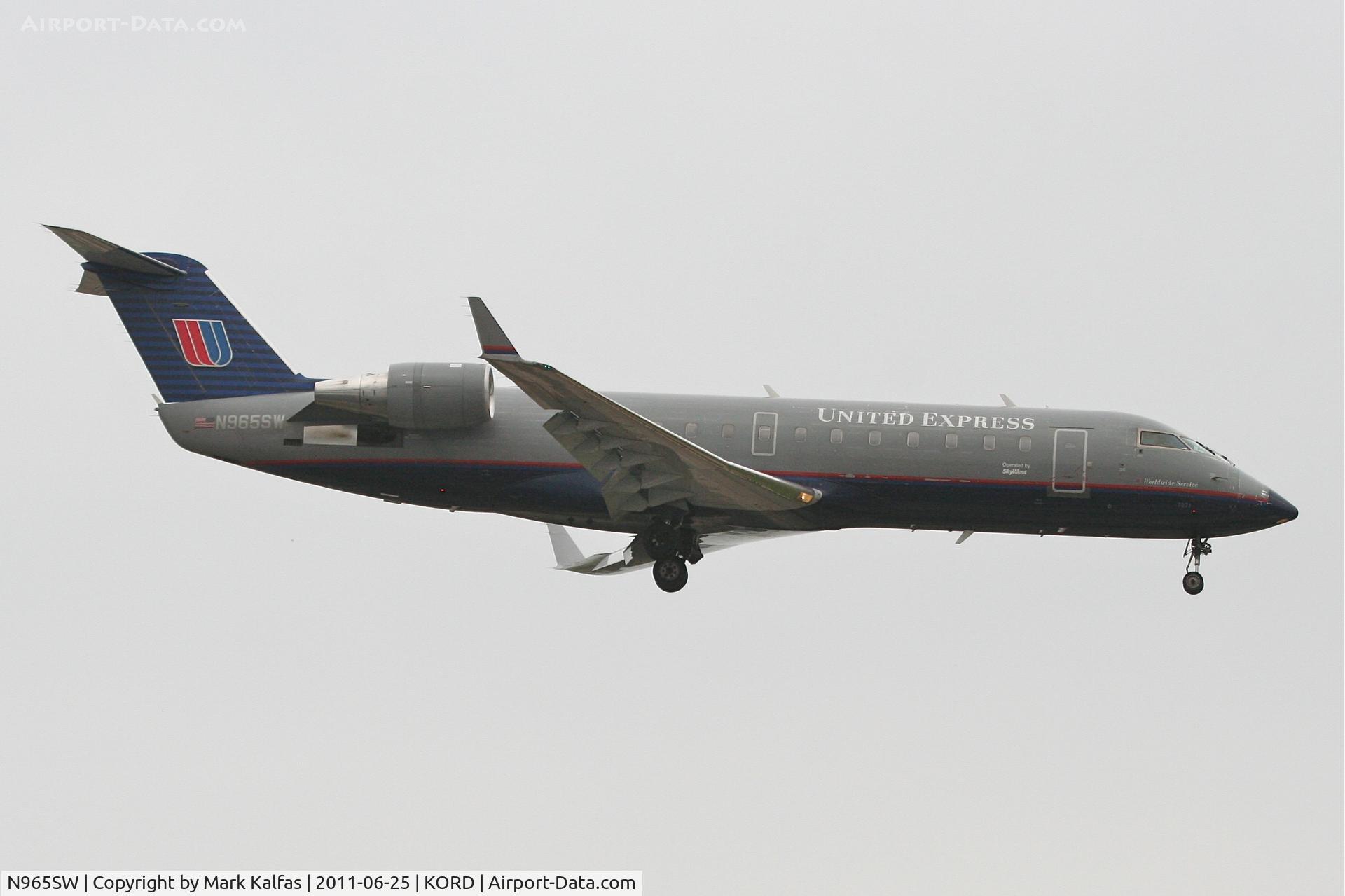 N965SW, 2003 Bombardier CRJ-200ER (CL-600-2B19) C/N 7871, SkyWest/United Express  Bombardier CL-600-2B19, SKW5540 arriving from Milwaukee / KMKE, RWY 14R approach KORD.