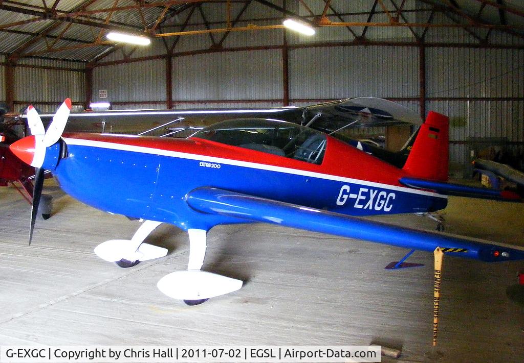G-EXGC, 1999 Extra EA-300/200 C/N 027, in the main hangar at Andrewsfield