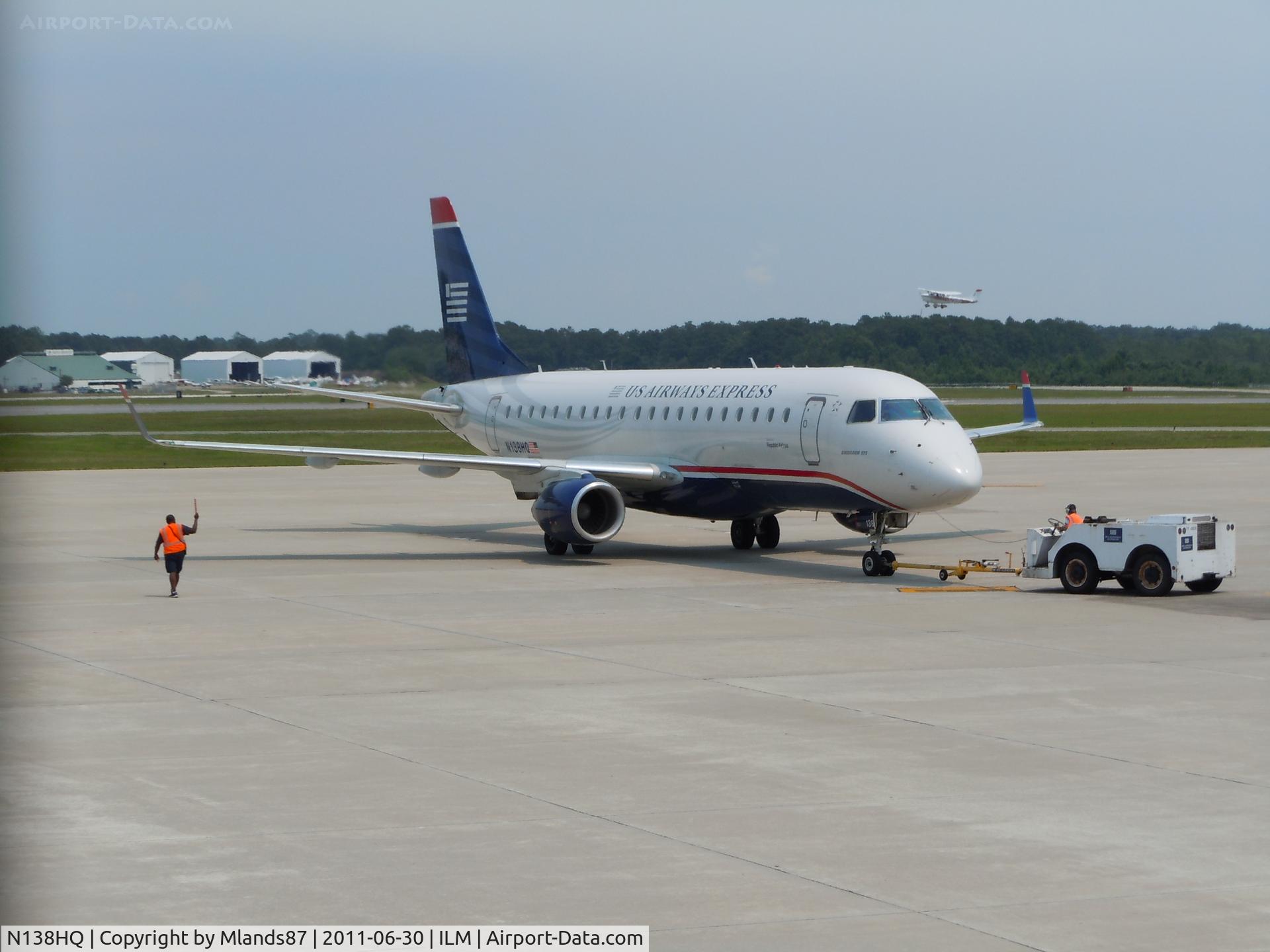 N138HQ, 2008 Embraer 175LR (ERJ-170-200LR) C/N 17000234, On push back with what appears to be a cessna in the backround