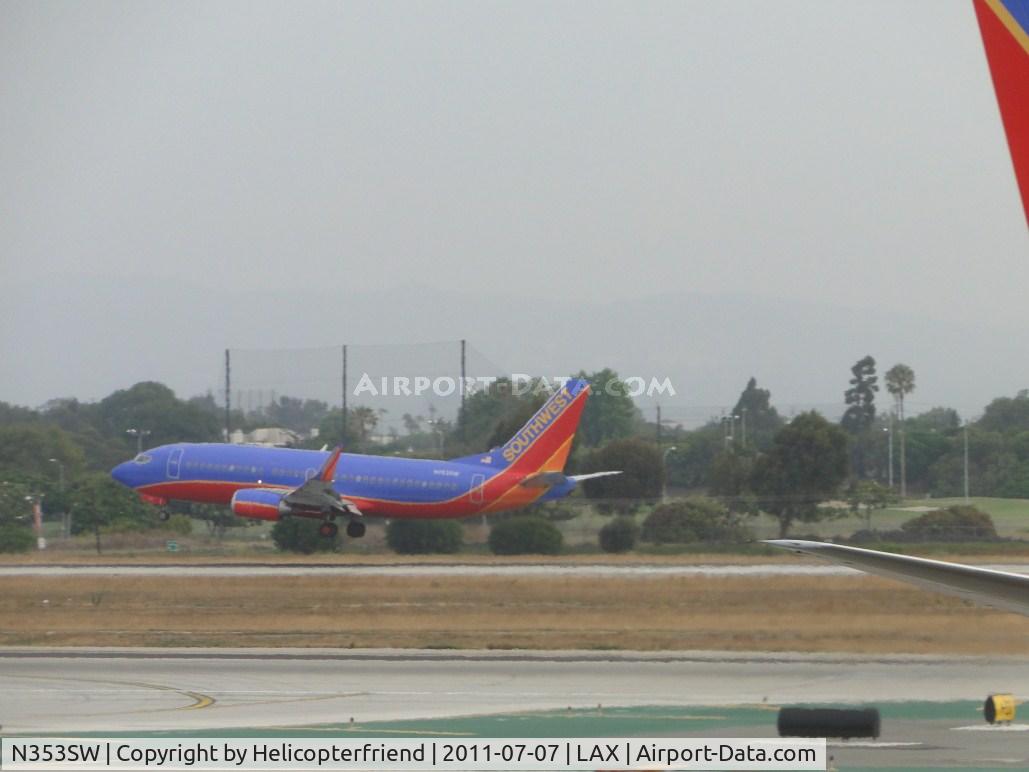 N353SW, 1990 Boeing 737-3H4 C/N 24889, Ready to touchdown down on runway 24R