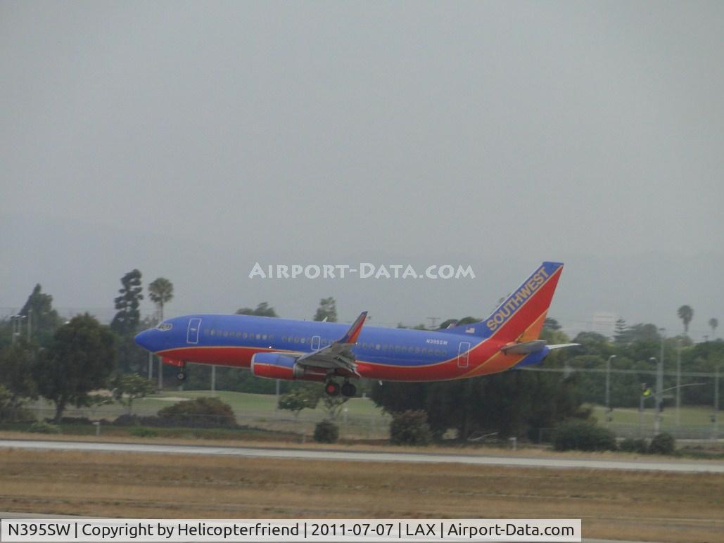 N395SW, 1994 Boeing 737-3H4 C/N 27689, Getting ready to touch down on runwy 24R