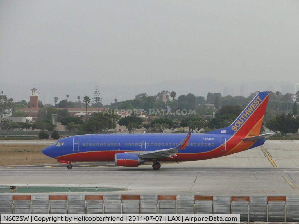 N602SW, 1995 Boeing 737-3H4 C/N 27953, Waiting to start take off roll on runway 24L
