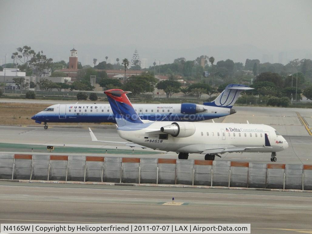 N416SW, 1995 Canadair CRJ-200 (CL-600-2B19) C/N 7089, Waiting to take off on runway 24L behind United Express N755SK