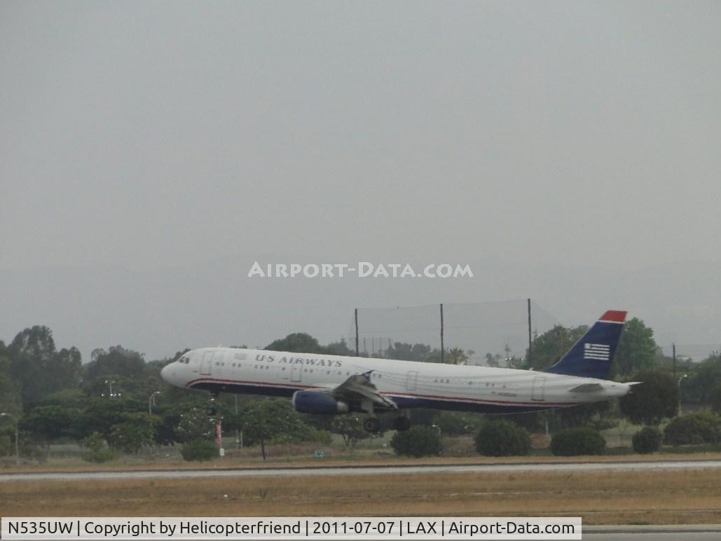 N535UW, 2009 Airbus A321-231 C/N 3993, Flaring out to let the main gear touch down first on runway 24R