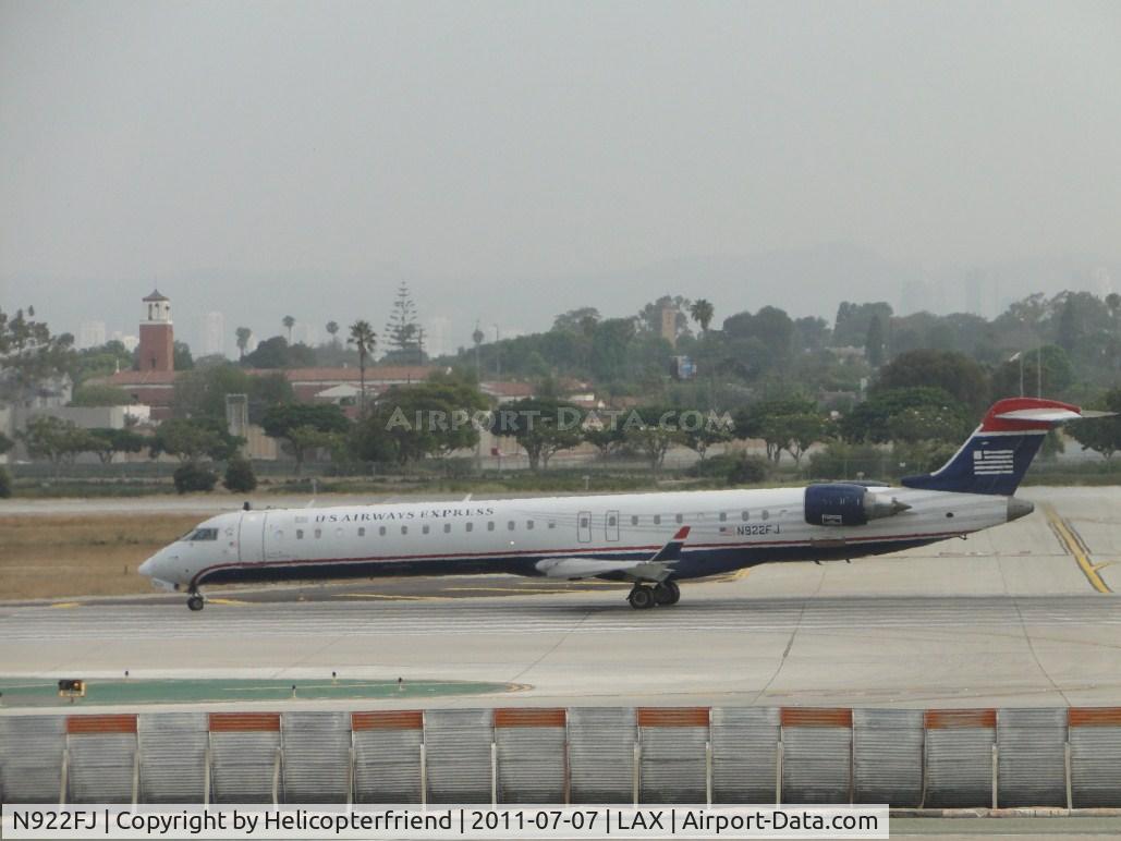N922FJ, 2004 Bombardier CRJ-900ER (CL-600-2D24) C/N 15022, Standing by on runway 24R waiting to start take off roll