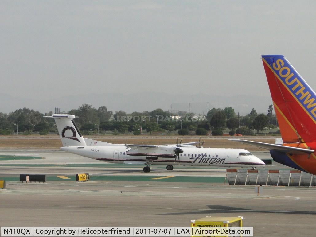 N418QX, 2007 Bombardier DHC-8-402 Dash 8 C/N 4143, Allowed passengers to disembark, loaded new passengers and is taxiing to runway 24L for take off