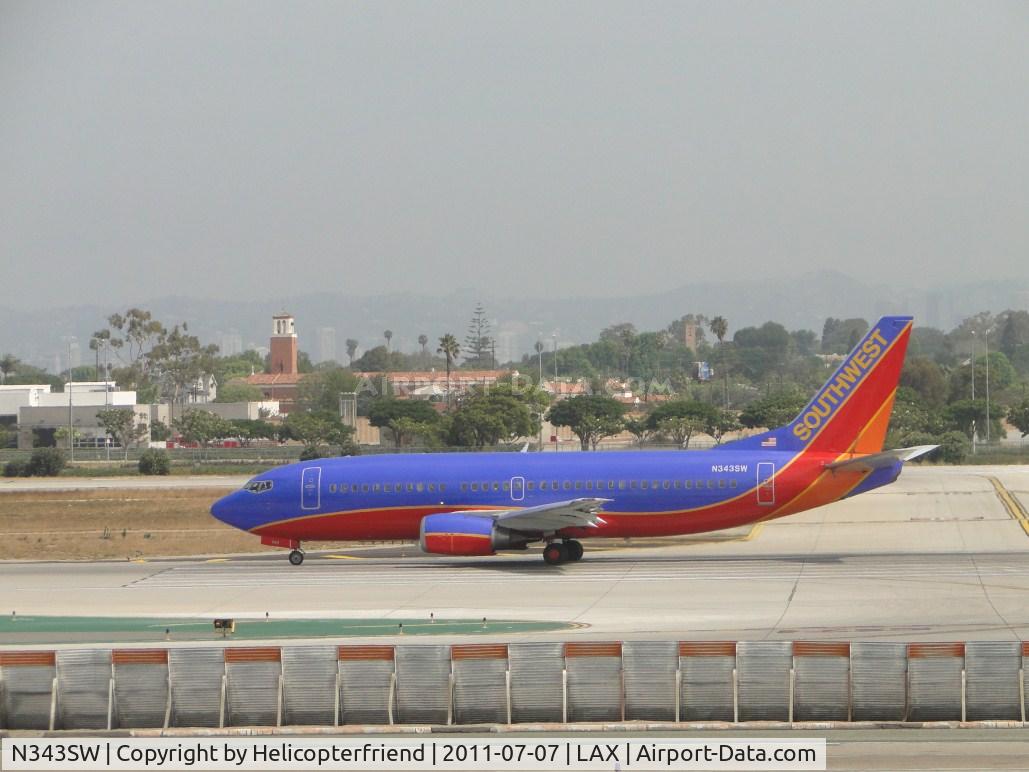 N343SW, 1989 Boeing 737-3H4 C/N 24151, Starting take off roll on runway 24L