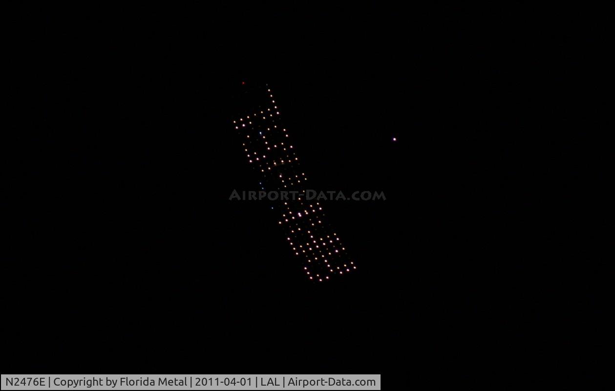 N2476E, 2001 Cessna 172S C/N 172S8784, Cessna 172S flying at night with electronic advertising