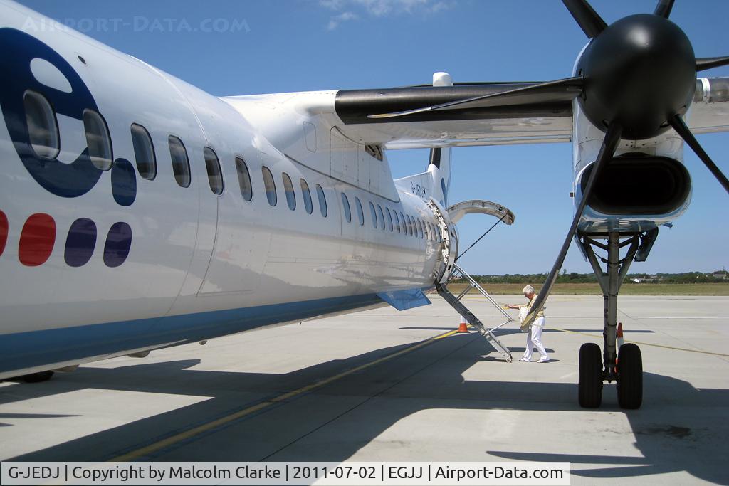 G-JEDJ, 2002 De Havilland Canada DHC-8-402Q Dash 8 C/N 4058, Boarding De Havilland Canada DHC-8-402Q Dash 8 at Jersey Airport, Channel Islands in July 2011.