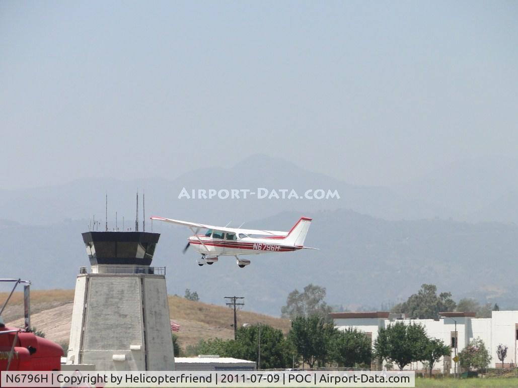N6796H, 1975 Cessna 172M C/N 17265584, taking off from runway 26L and passing the tower for a straight departure