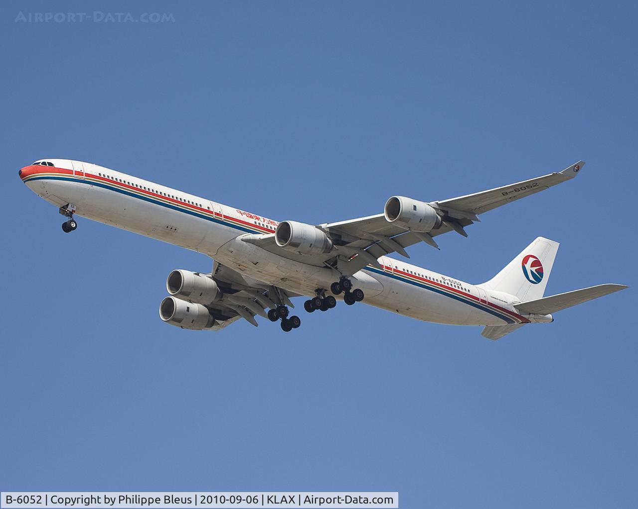 B-6052, 2003 Airbus A340-642 C/N 514, Short final rwy 24R.