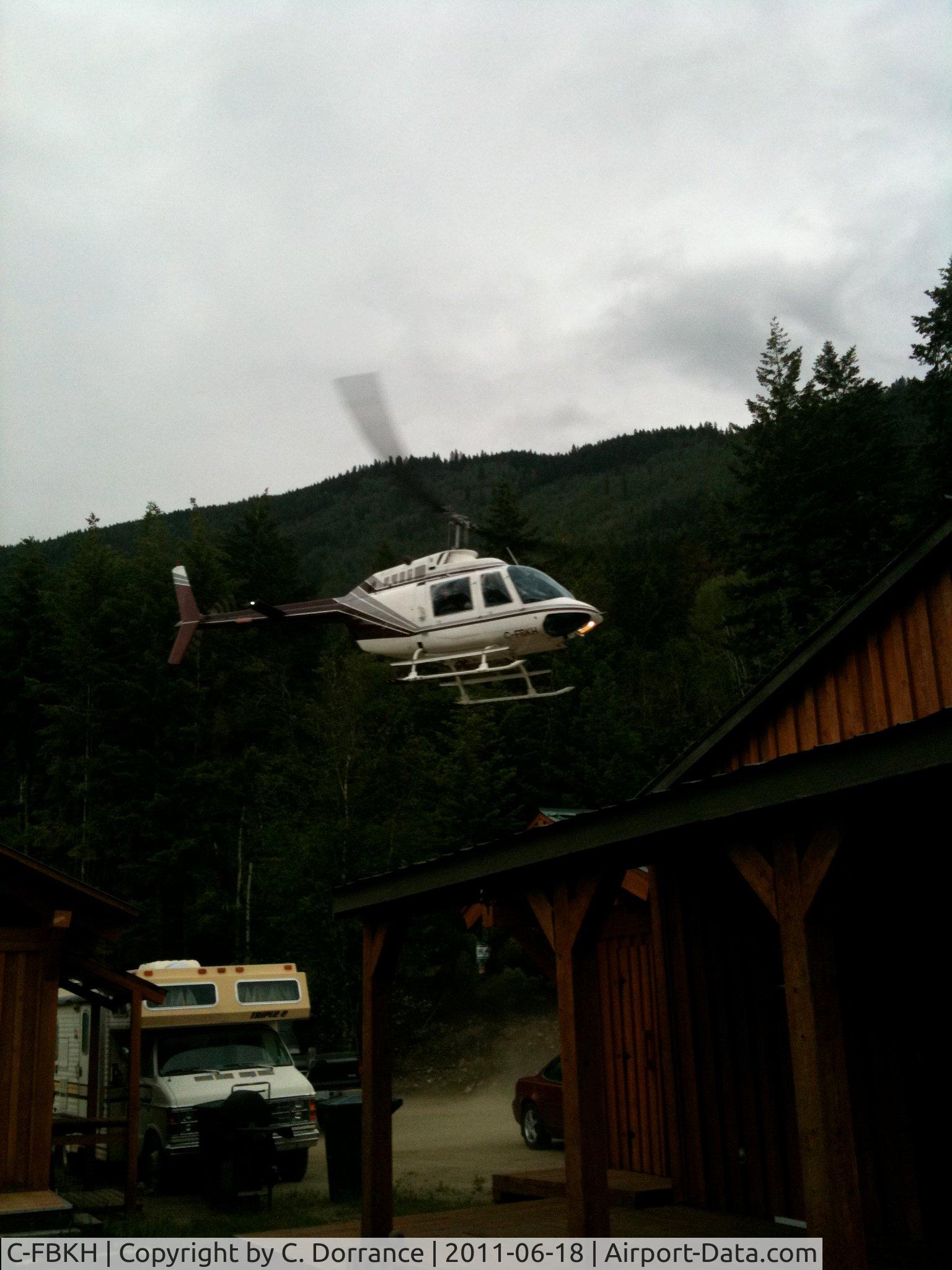 C-FBKH, 1970 Bell Bell 206B-2 Jet Ranger C/N 575, C-FBKH Landing on shore of Little Shuswap Lake, Chase, BC.