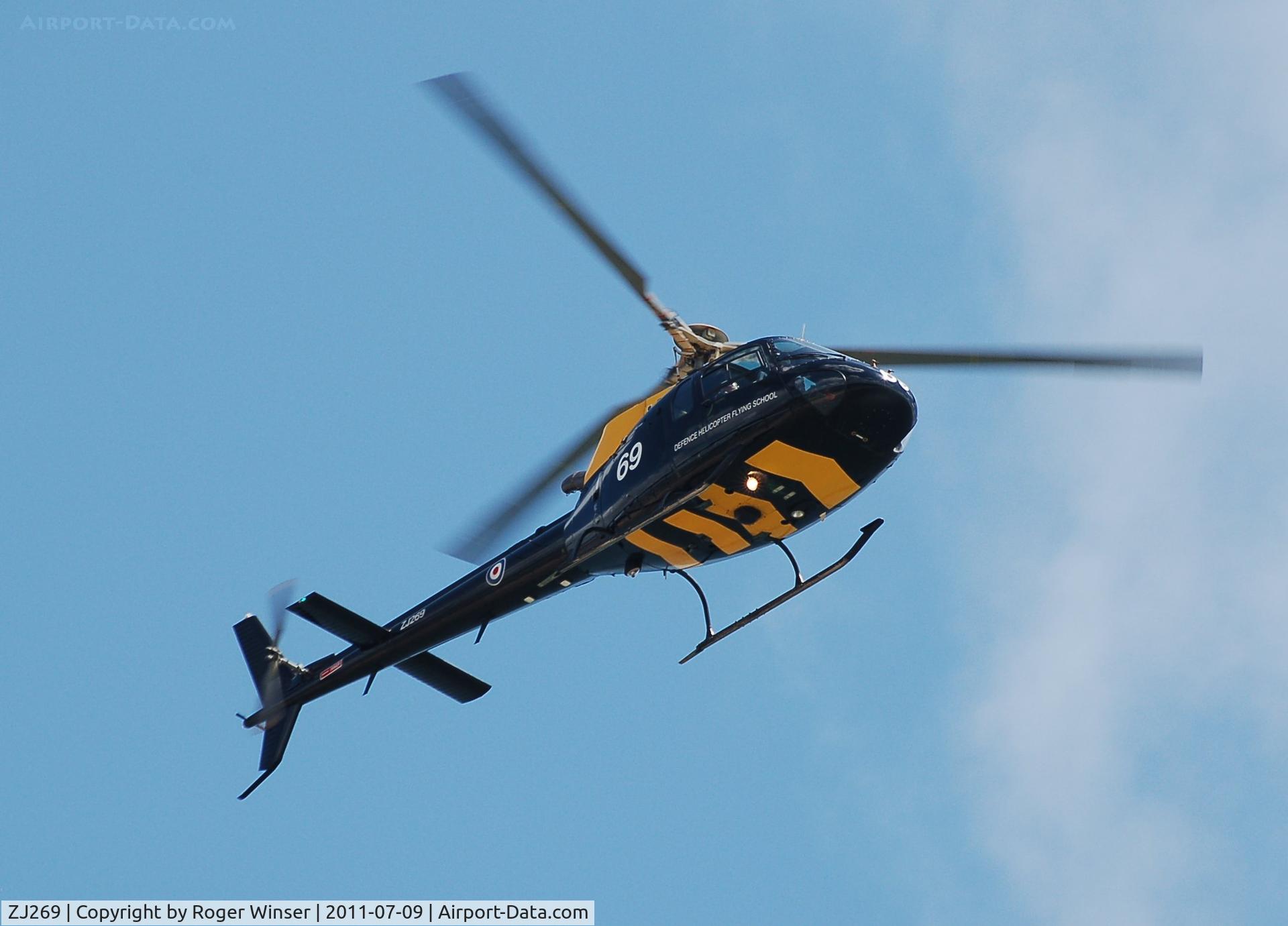 ZJ269, 1997 Eurocopter AS-350BB Squirrel HT1 Ecureuil C/N 2999, Off airport. Coded 69. Flyby during the Wales National Airshow, Swansea Bay, Wales, UK.