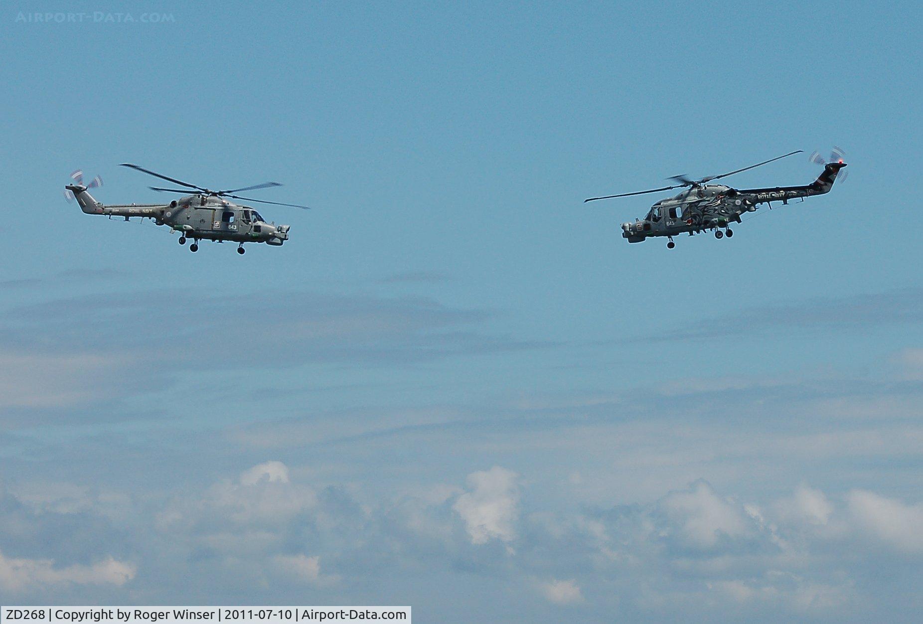 ZD268, 1983 Westland Lynx HMA.8SRU C/N 309, Off airport. Coded 643 with XZ722 coded 645 of 702 NAS's Black Cats Display Team at the Wales National Airshow, Swansea Bay, Wales, UK.