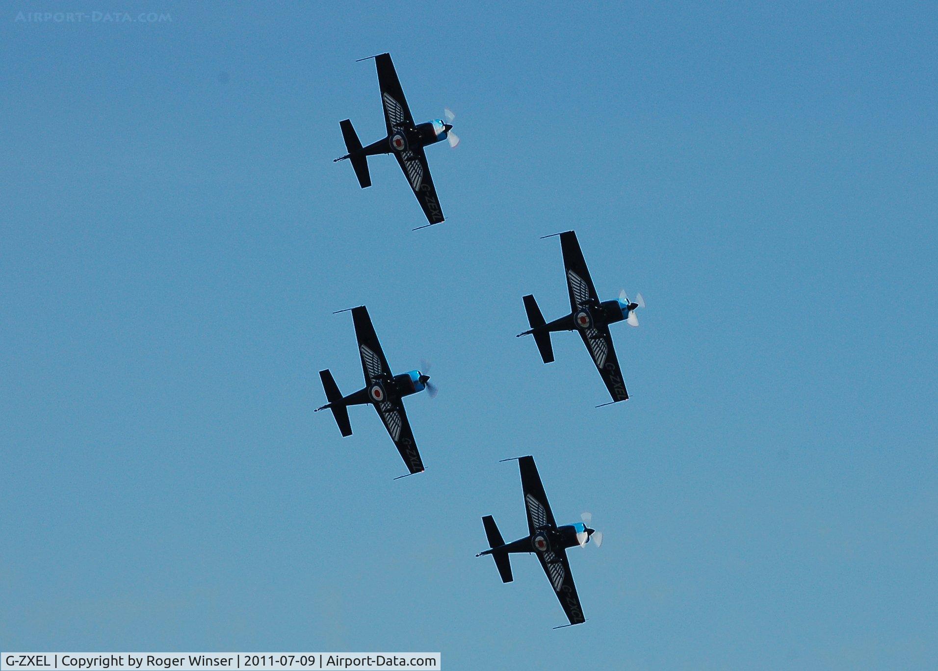 G-ZXEL, 2006 Extra EA-300L C/N 1224, Off airport. Leading The Blades aerobatic display team at the Wales National Airshow, Swansea Bay, Wales, UK.