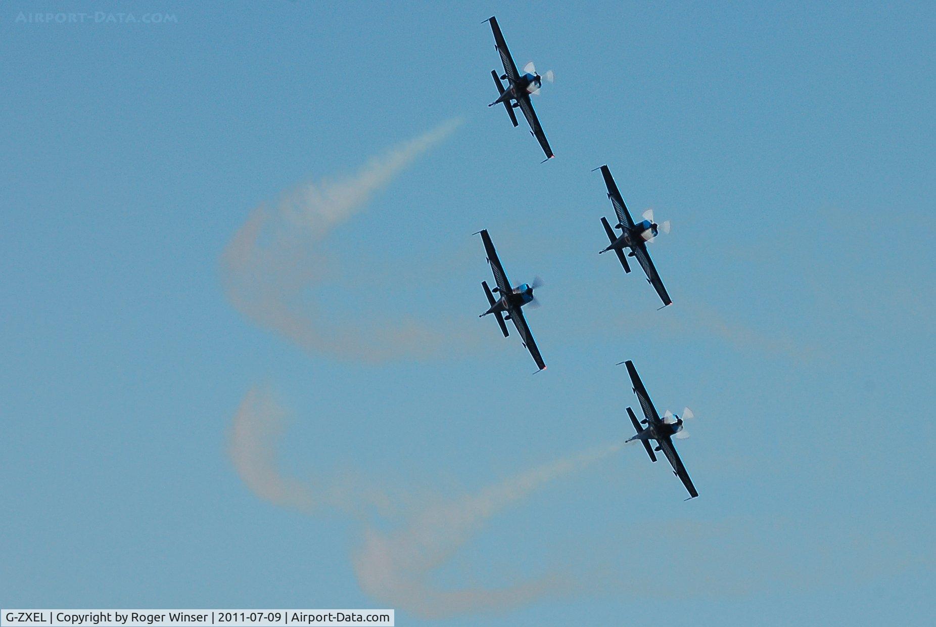 G-ZXEL, 2006 Extra EA-300L C/N 1224, Off airport. Leading The Blades aerobatic display team at the Wales National Airshow, Swansea Bay, Wales, UK.