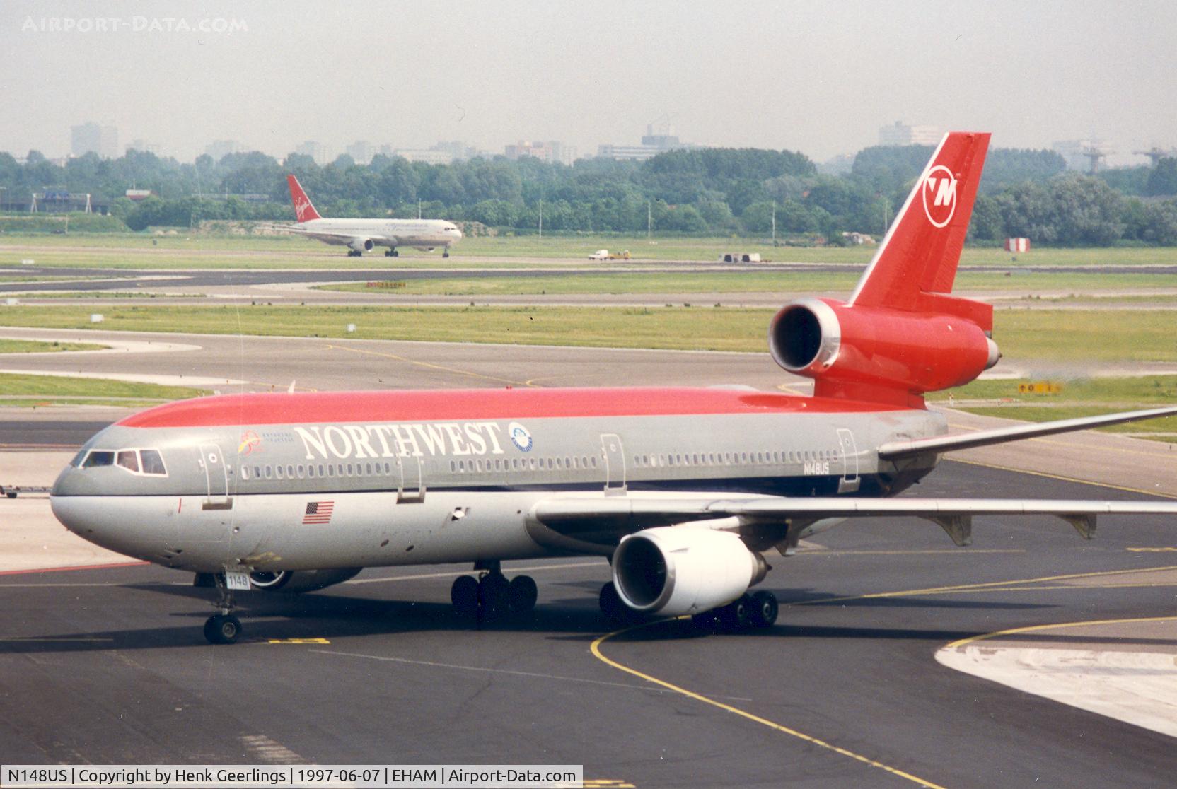 N148US, 1973 Douglas DC-10-40 C/N 46757, Northwest. In the background B767 from Martinair lsd to Virgin