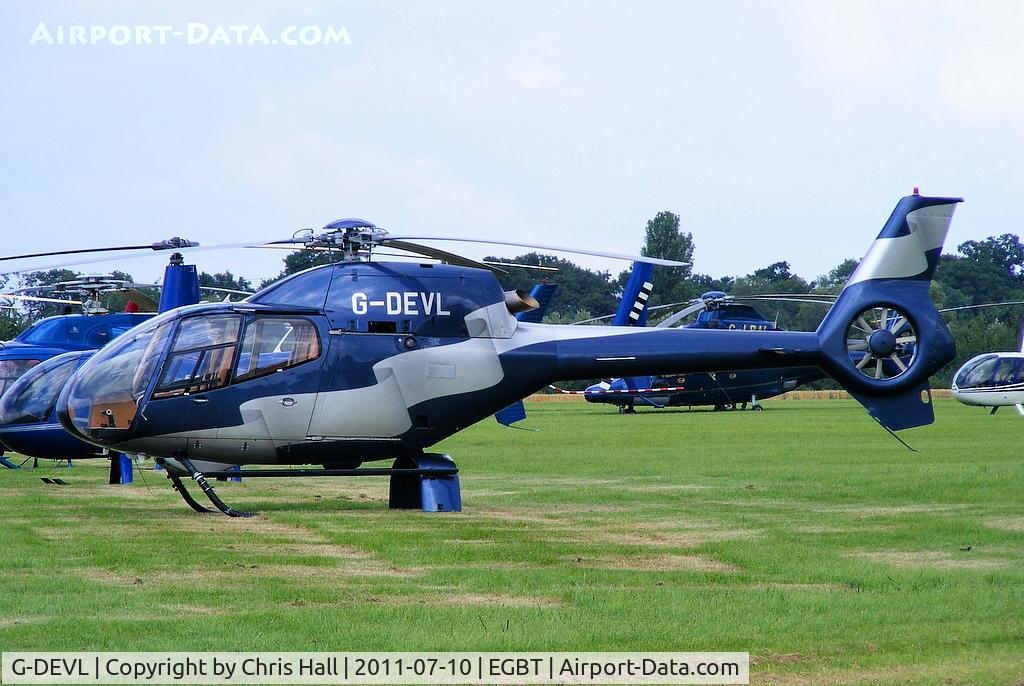 G-DEVL, 2001 Eurocopter EC-120B Colibri C/N 1273, being used for ferrying race fans to the British F1 Grand Prix at Silverstone