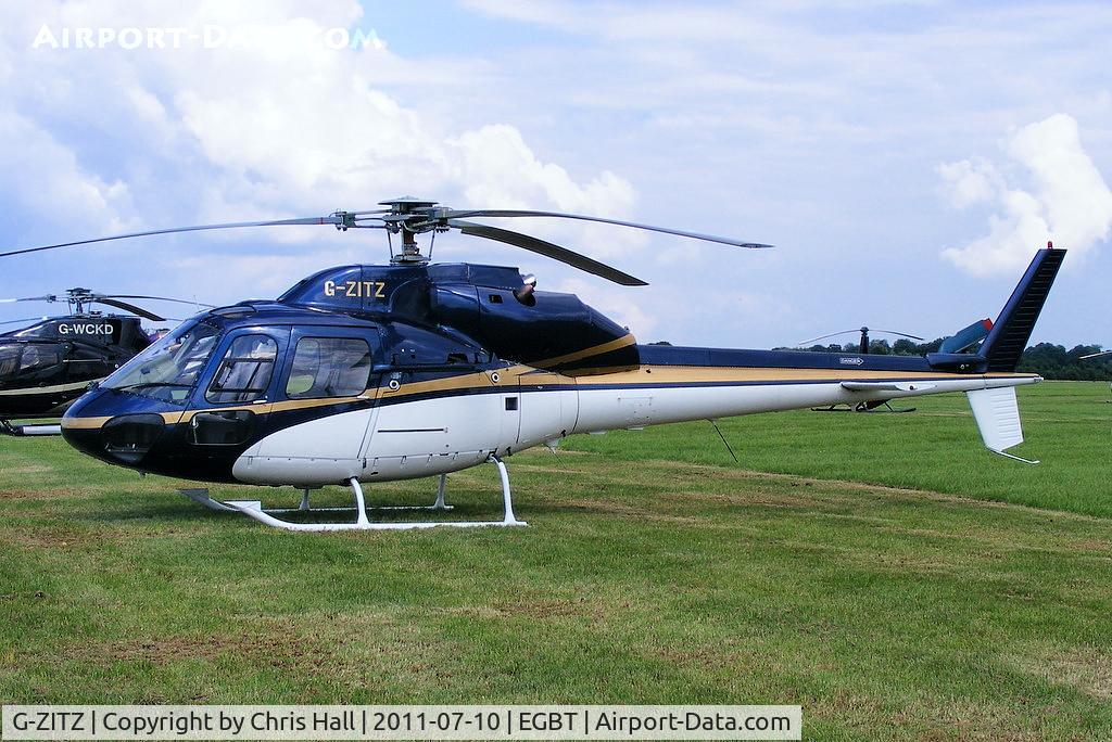 G-ZITZ, 1983 Aerospatiale AS-355F-2 Ecureuil 2 C/N 5135, being used for ferrying race fans to the British F1 Grand Prix at Silverstone