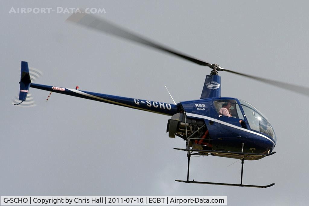 G-SCHO, 2005 Robinson R22 Beta II C/N 3833, being used for ferrying race fans to the British F1 Grand Prix at Silverstone