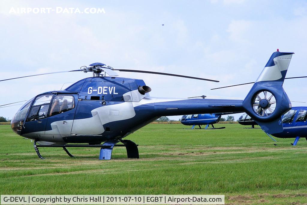 G-DEVL, 2001 Eurocopter EC-120B Colibri C/N 1273, being used for ferrying race fans to the British F1 Grand Prix at Silverstone
