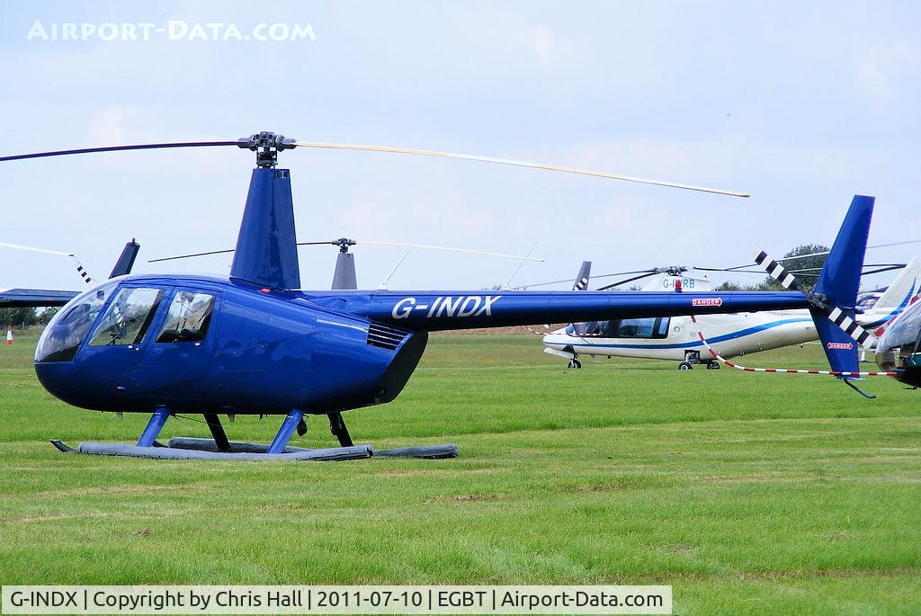G-INDX, 2004 Robinson R44 Clipper II C/N 10491, being used for ferrying race fans to the British F1 Grand Prix at Silverstone