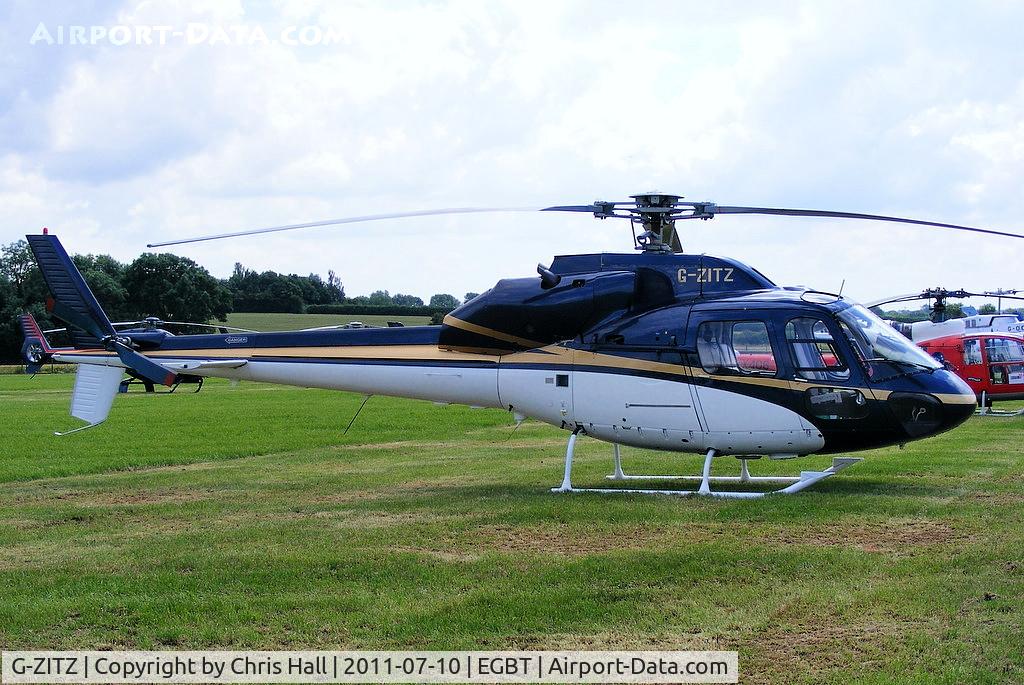 G-ZITZ, 1983 Aerospatiale AS-355F-2 Ecureuil 2 C/N 5135, being used for ferrying race fans to the British F1 Grand Prix at Silverstone