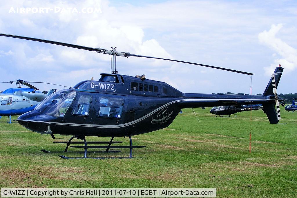G-WIZZ, 1977 Agusta AB-206B JetRanger II C/N 8540, being used for ferrying race fans to the British F1 Grand Prix at Silverstone